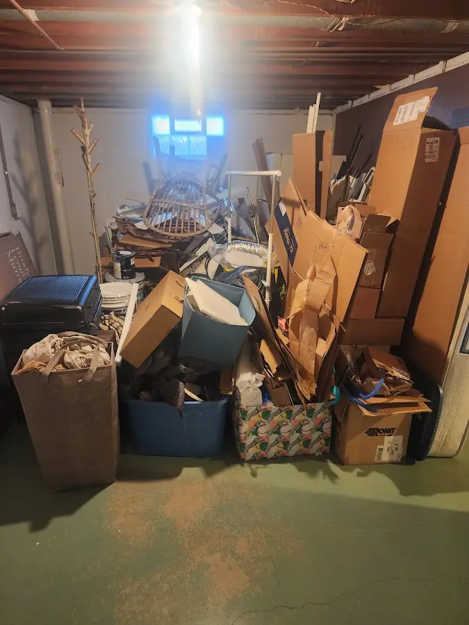 Roll-off dumpster container at job site for 15 Yard Dumpster Rental in Cliffside Park