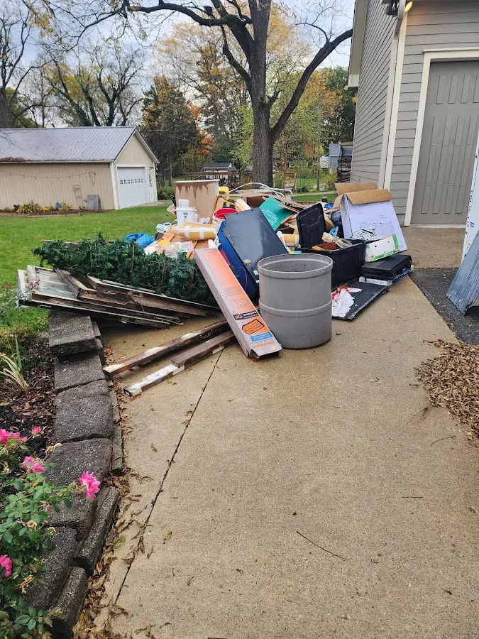 Dumpster being loaded with debris for 10 Yard Dumpster Rental in Cliffside Park